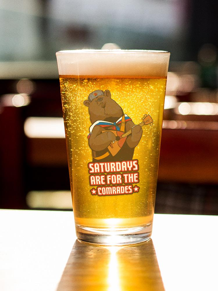 a glass of beer with a bear on it