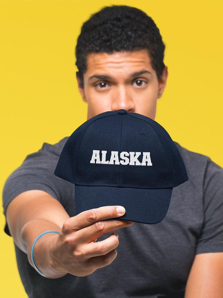 a man holding a hat