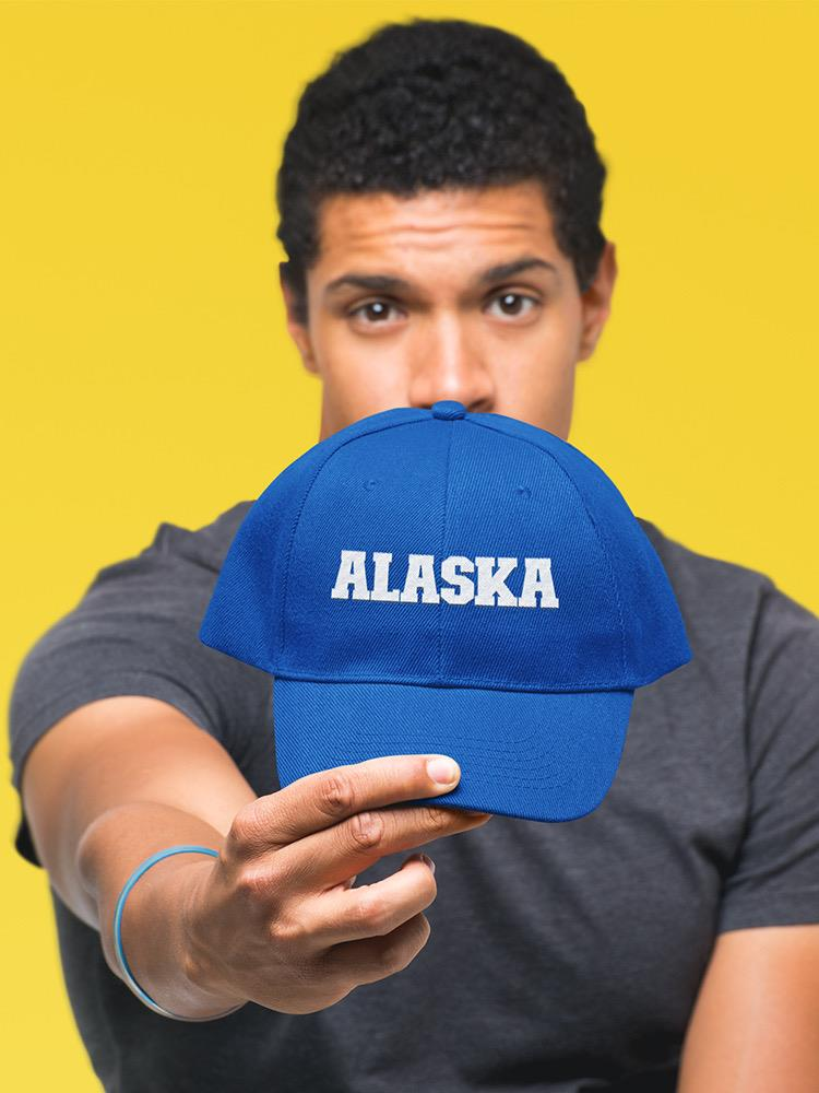 a man holding a blue hat