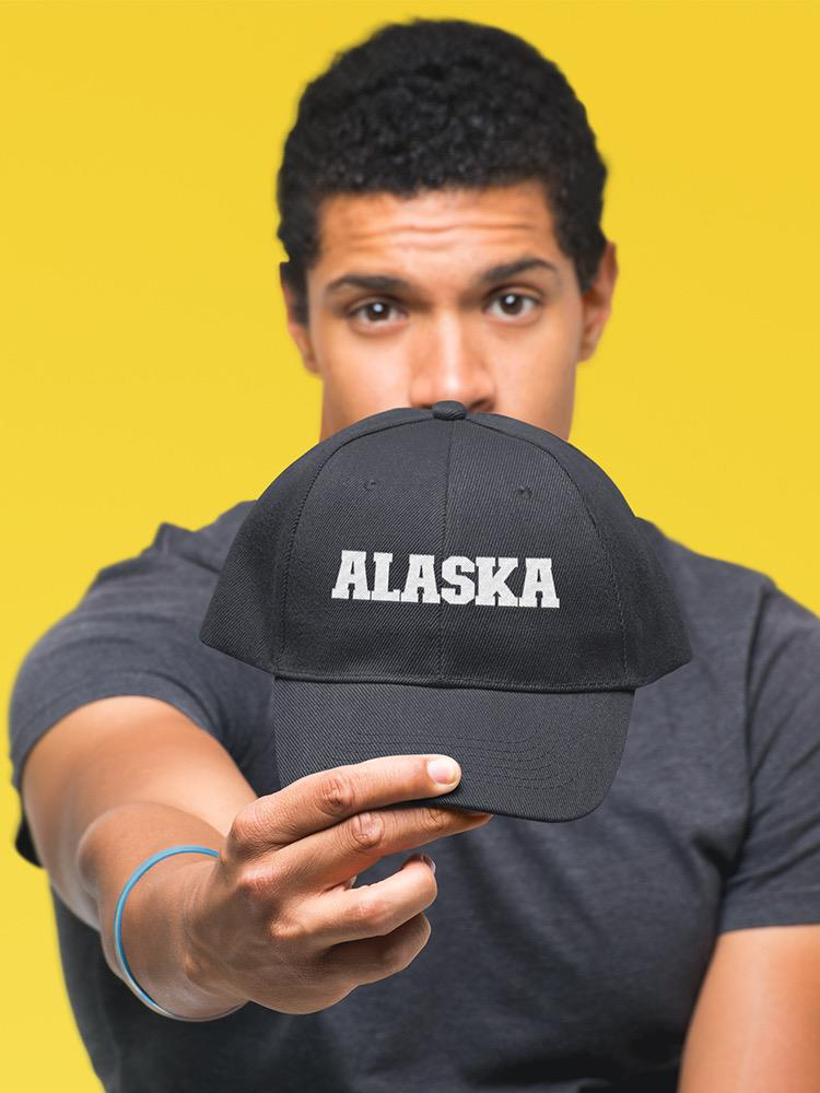 a man holding a hat