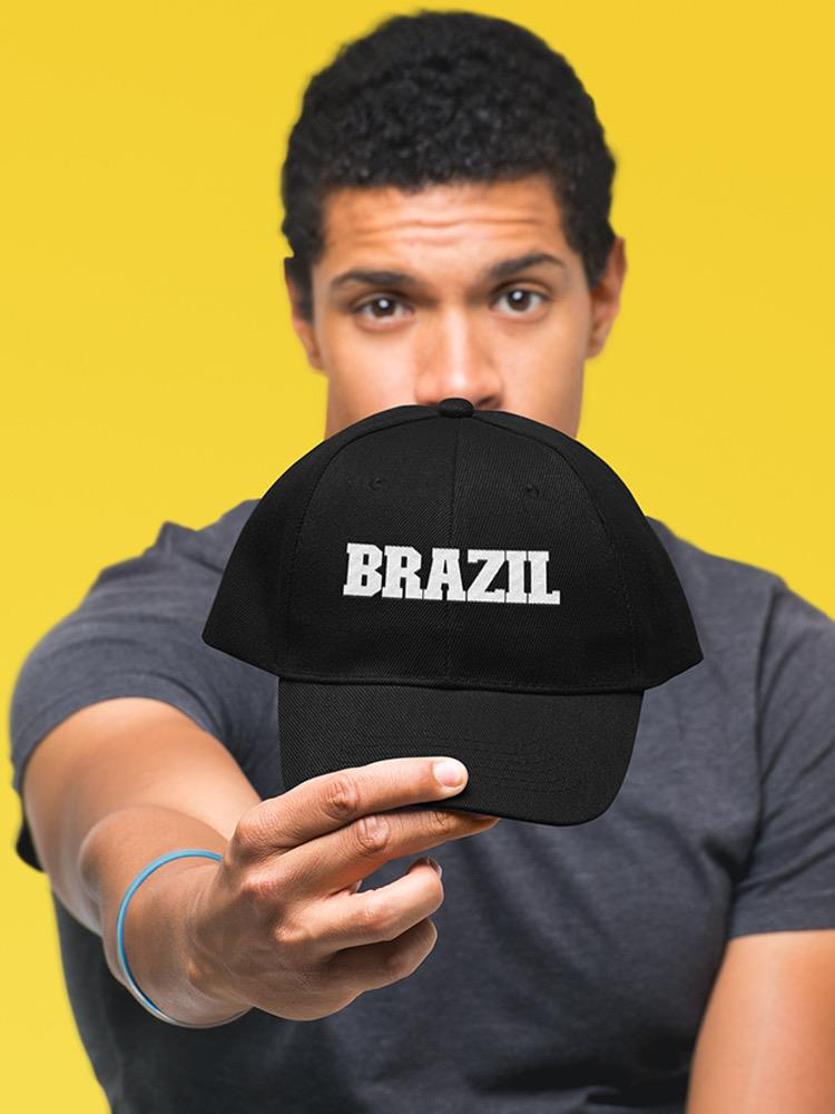 a man holding a black hat