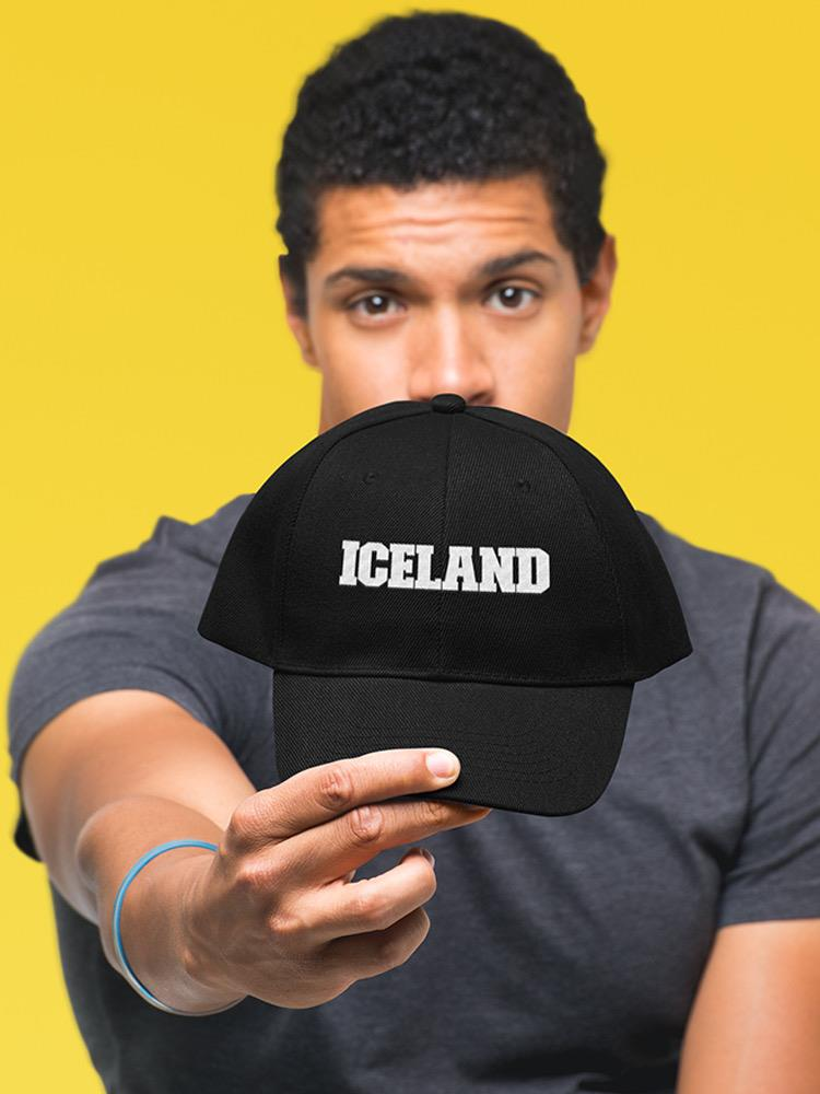 a man holding a black hat