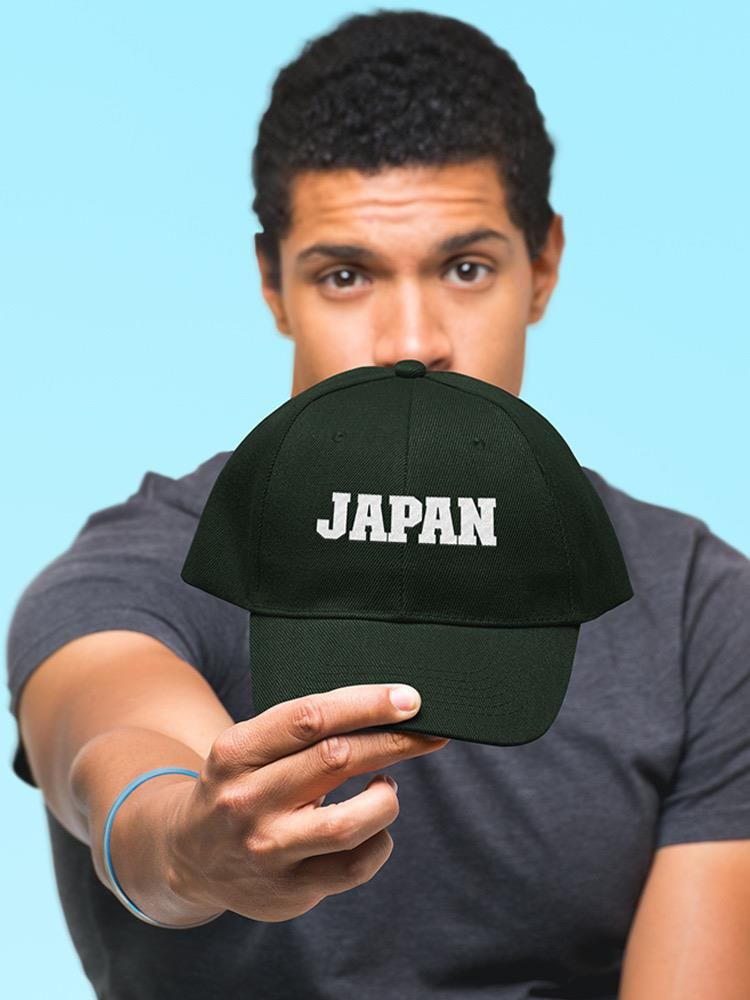 a man holding a hat