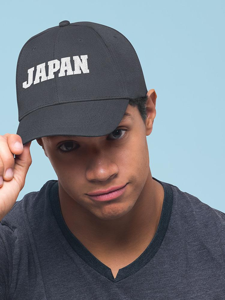 a man wearing a black hat