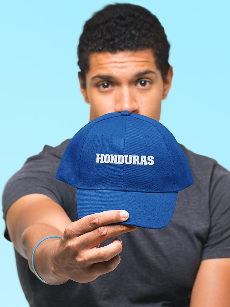 a man holding a blue hat