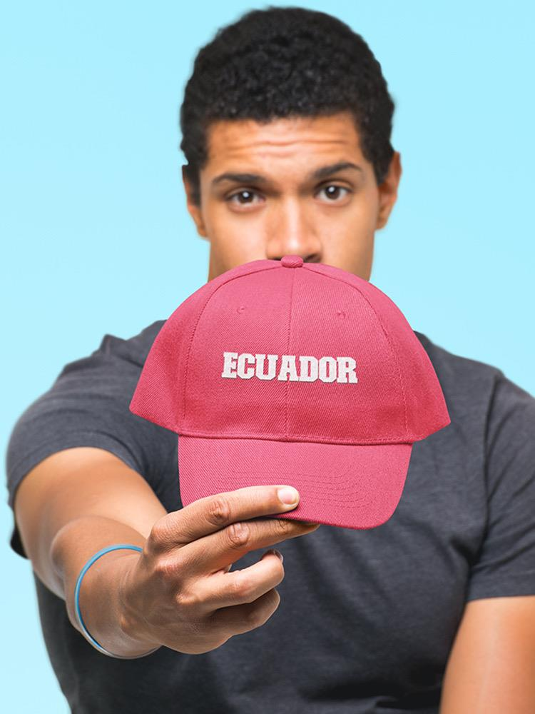 a man holding a red hat
