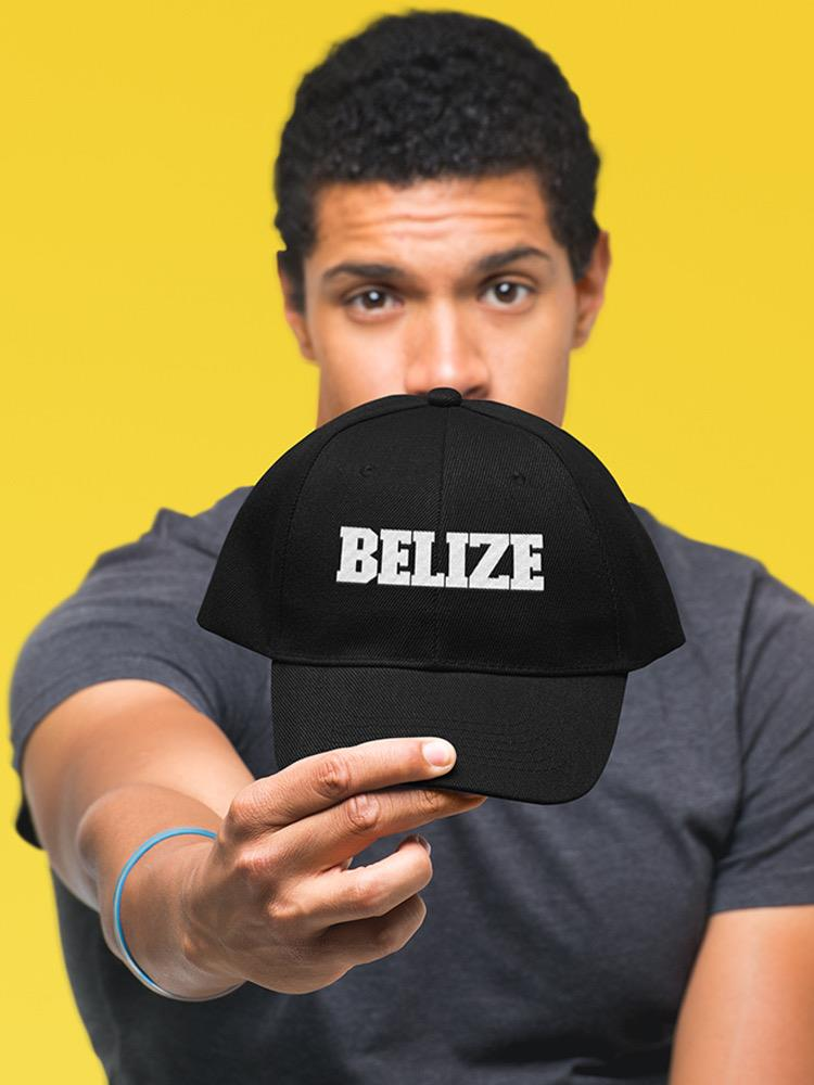 a man holding a black hat
