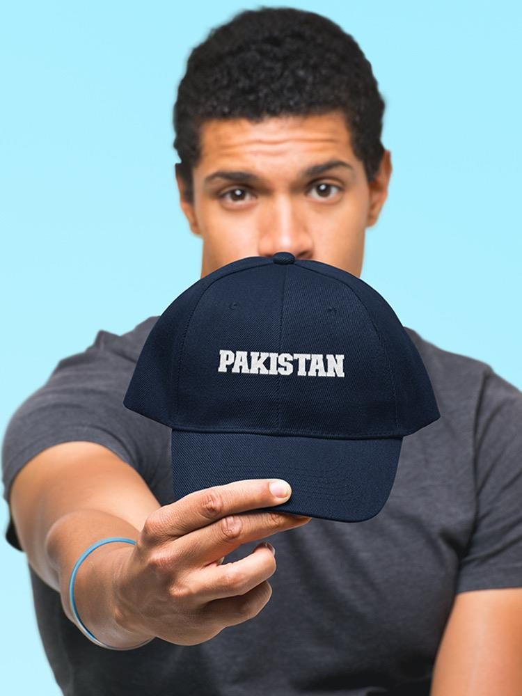 a man holding a hat