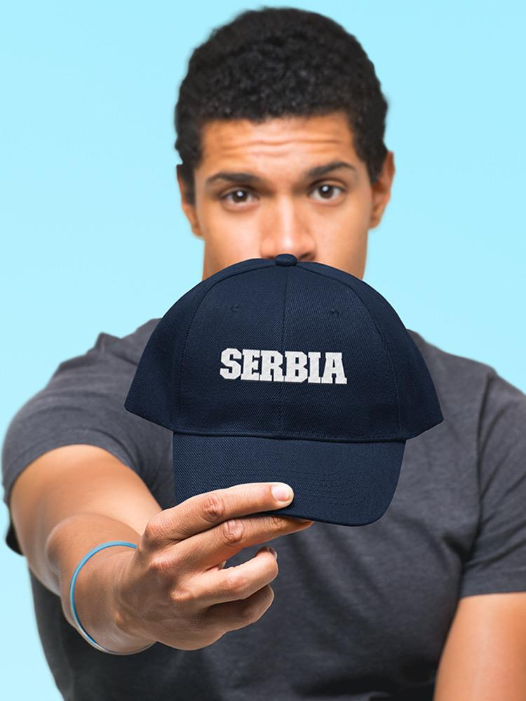 a man holding a hat
