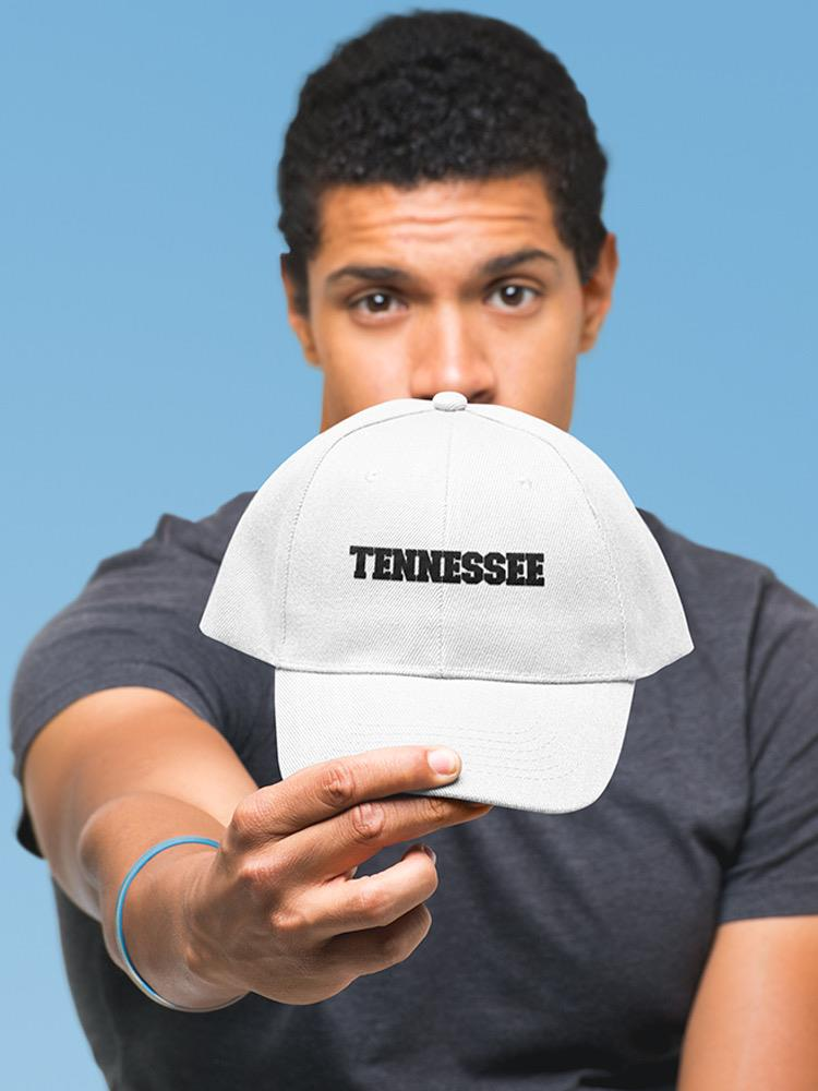 a man holding a hat