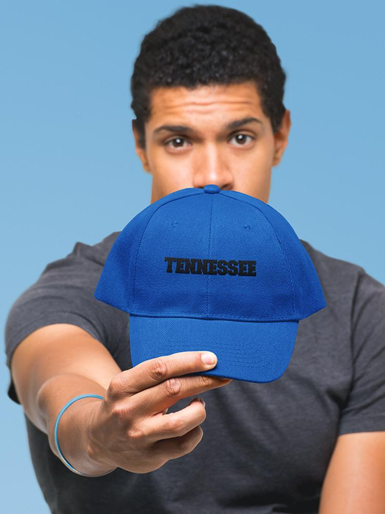 a man holding a blue hat