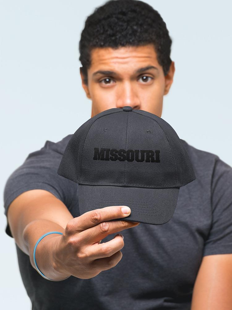 a man holding a hat