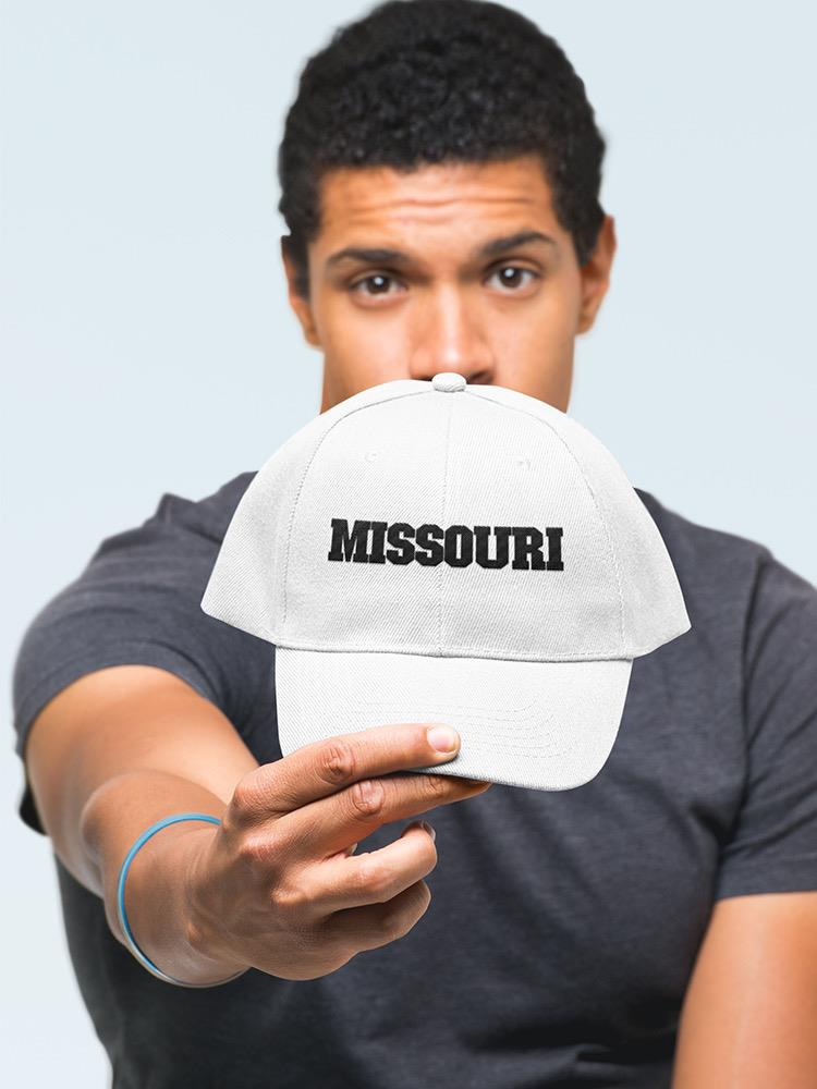 a man holding a hat