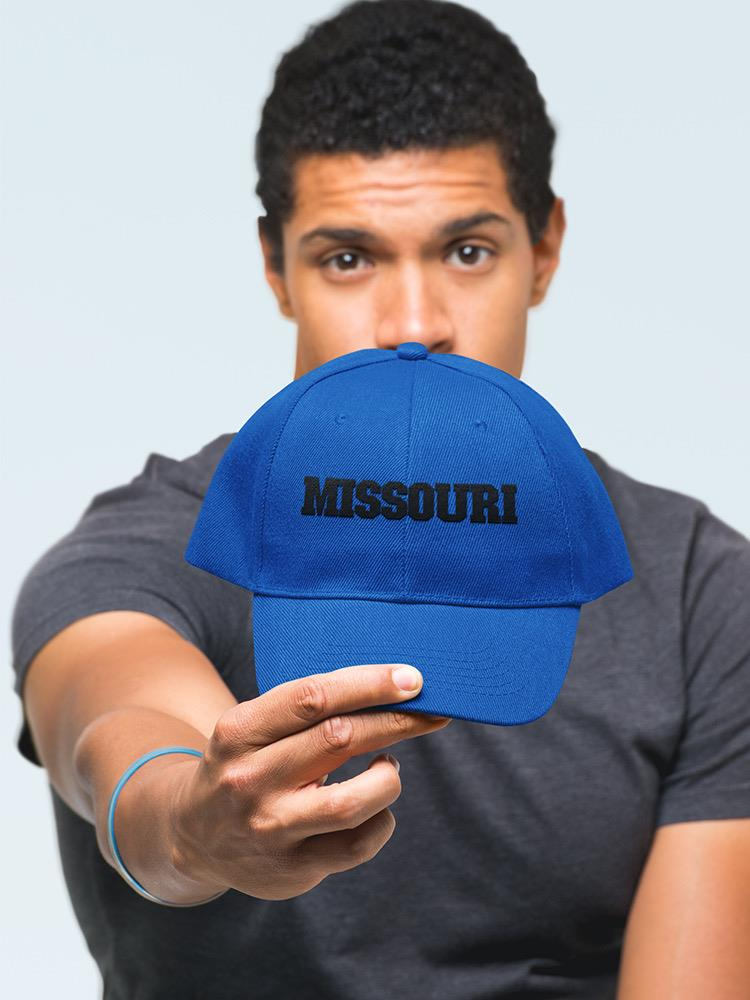 a man holding a blue hat