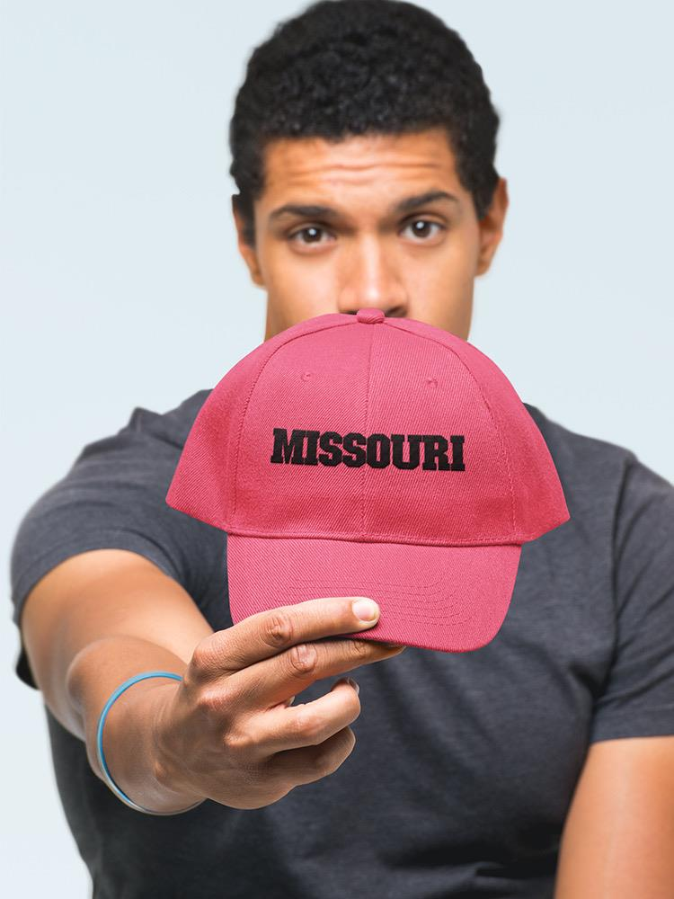 a man holding a hat