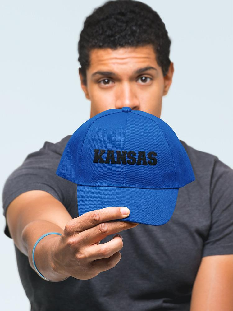 a man holding a blue hat