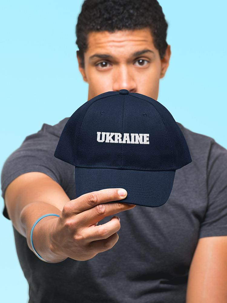 a man holding a hat