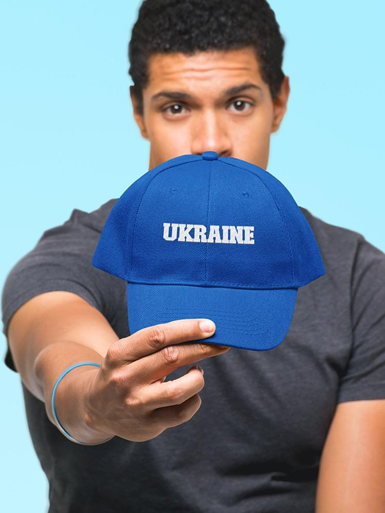 a man holding a blue hat