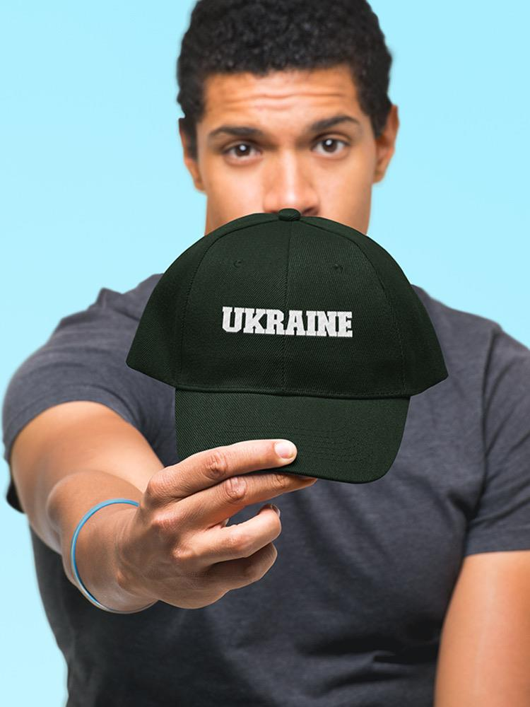a man holding a hat