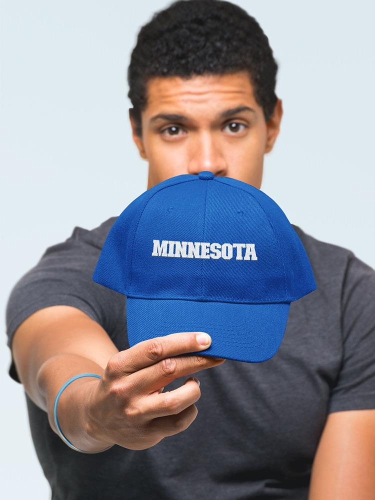 a man holding a blue hat