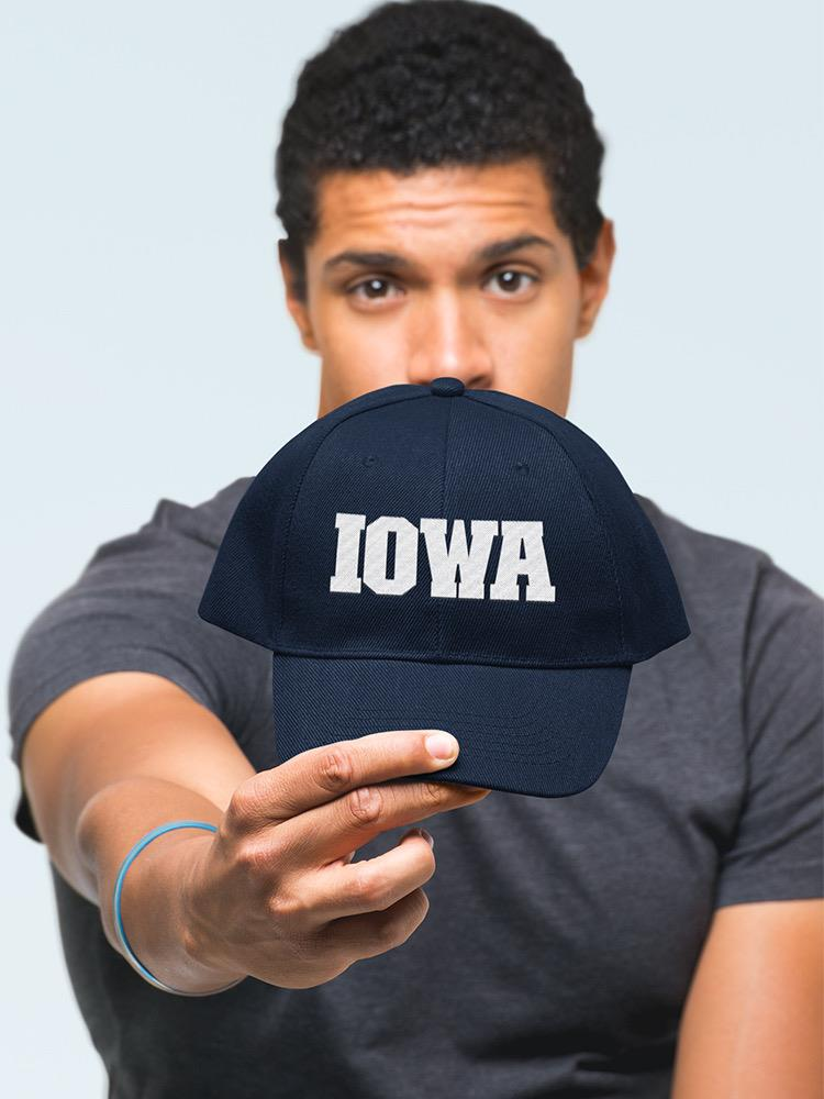 a man holding a hat