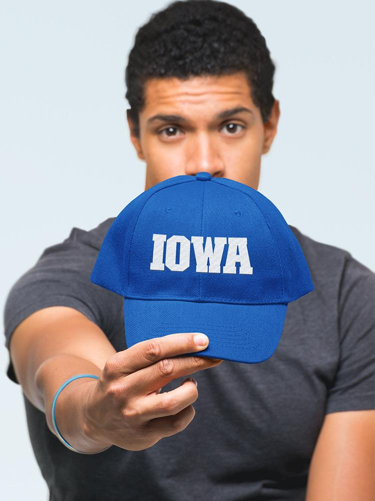 a man holding a blue hat