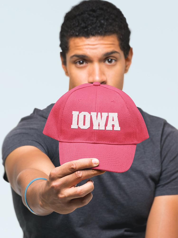a man holding a red hat
