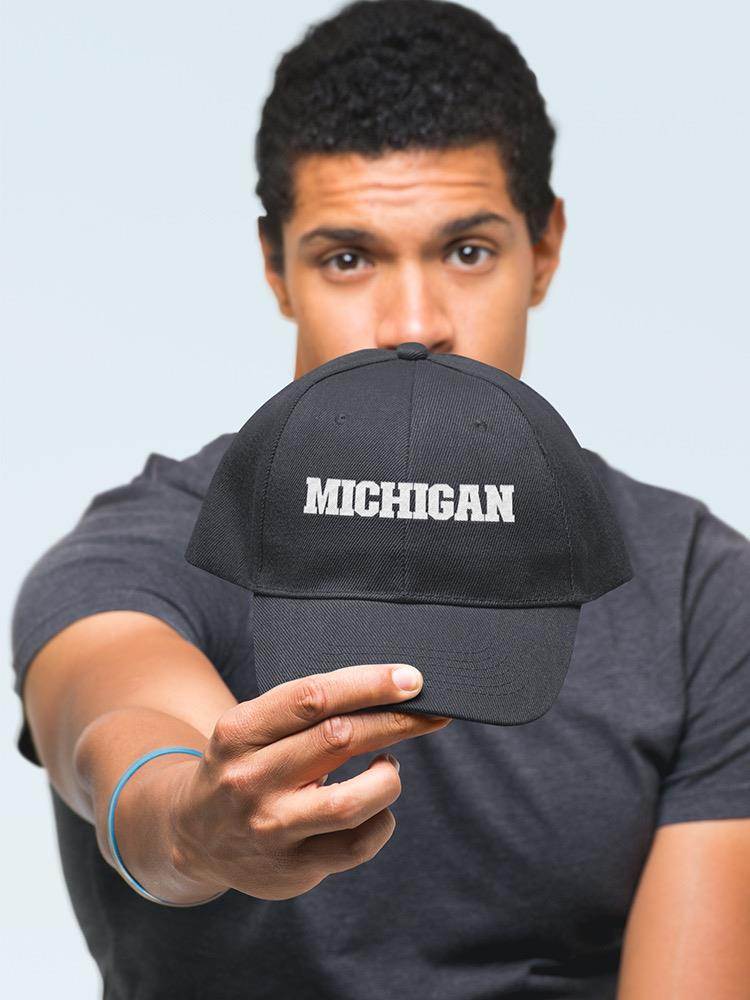 a man holding a hat