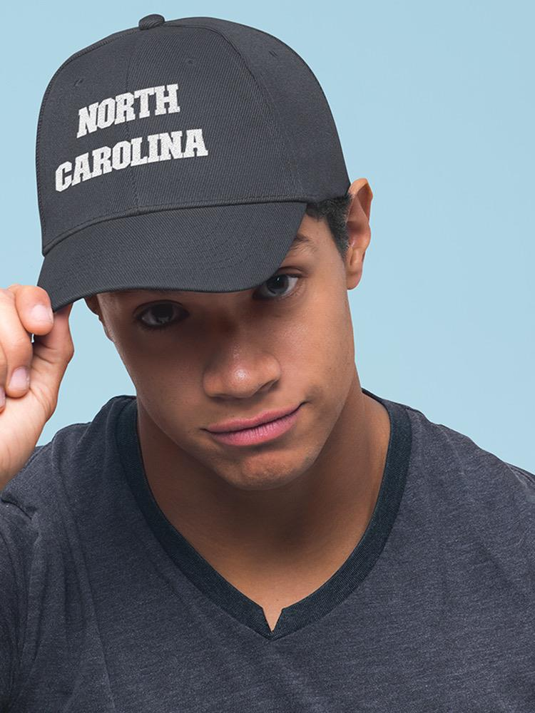 a man wearing a black hat