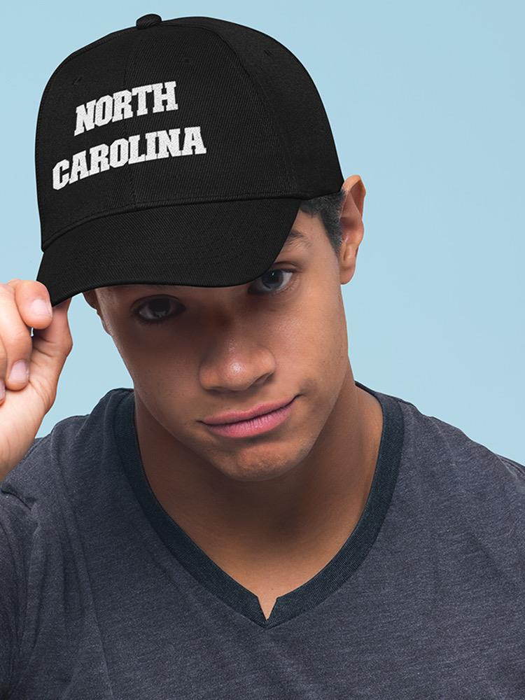 a man wearing a black hat