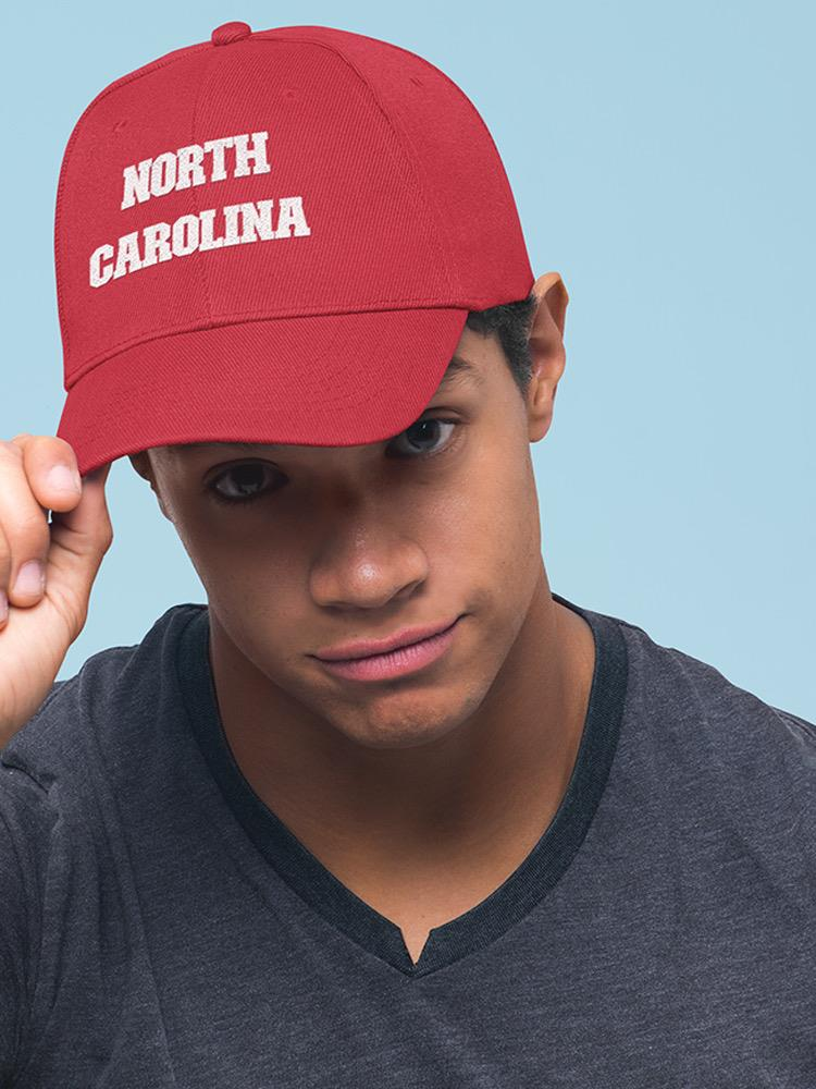 a man wearing a red hat