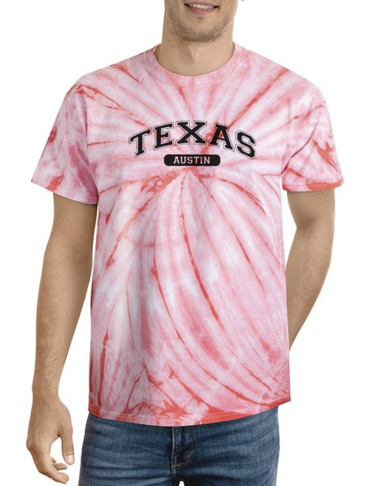 a man wearing a tie dye shirt