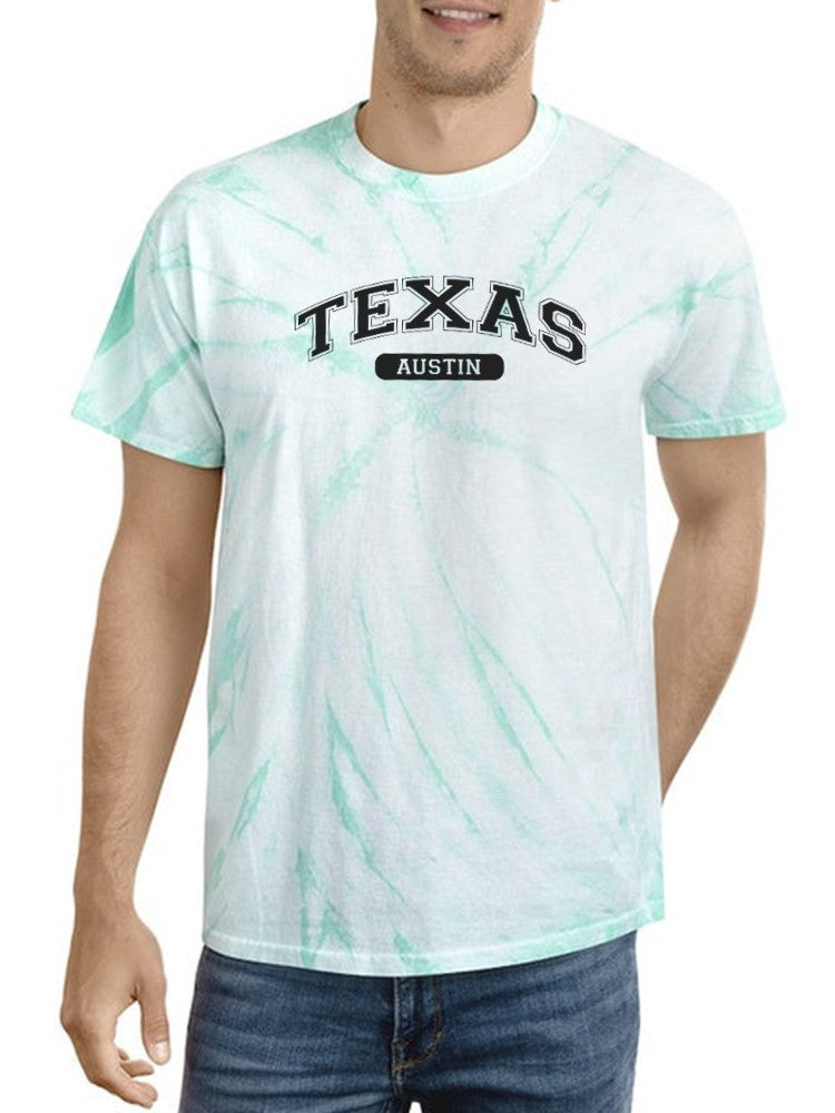 a man wearing a tie dye shirt