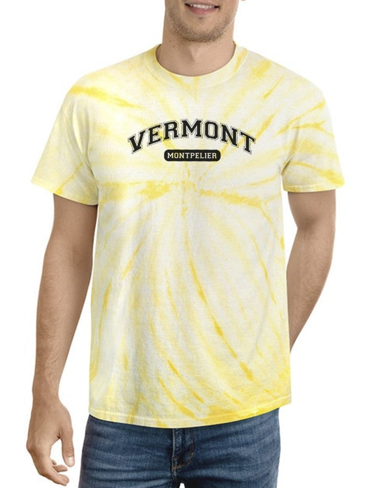 a man wearing a tie dye shirt