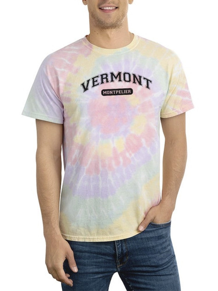a man wearing a tie dye shirt