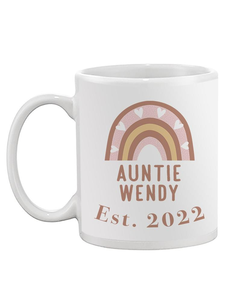 a white mug with a rainbow and text