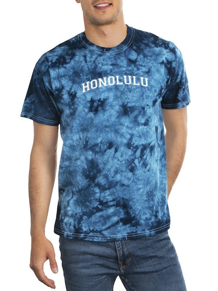 a man wearing a tie dye shirt