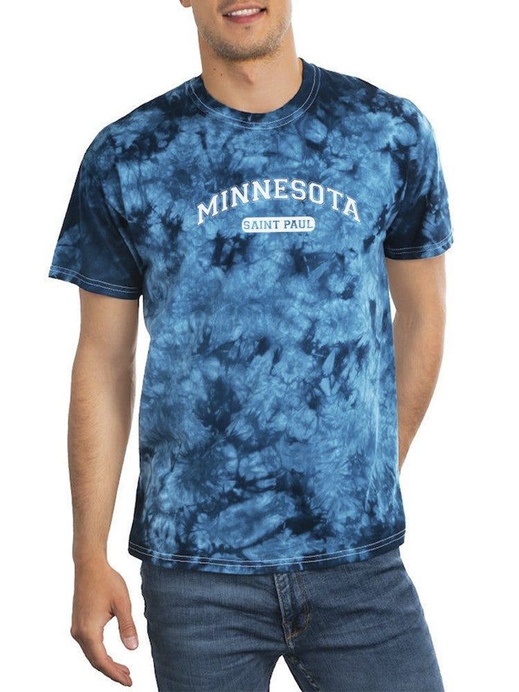 a man wearing a tie dye shirt