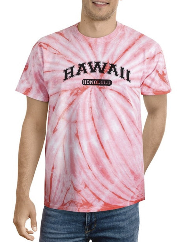 a man wearing a tie dye shirt