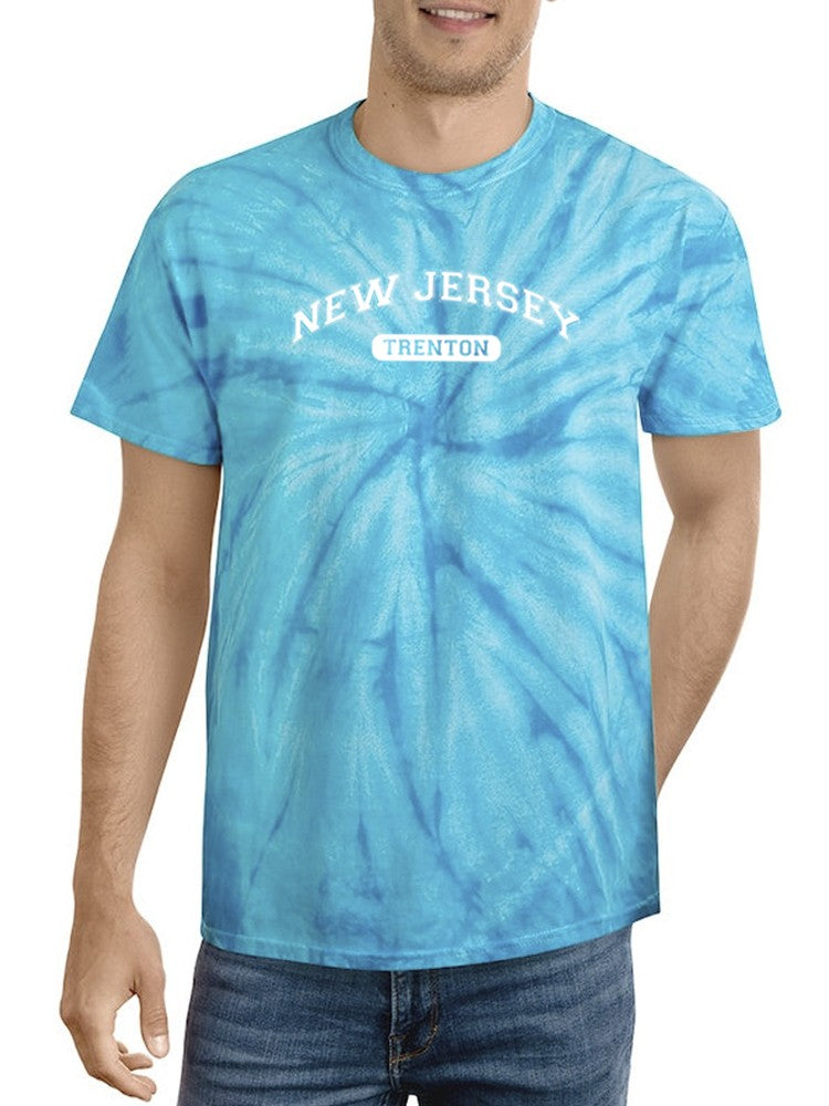 a man wearing a tie dye shirt
