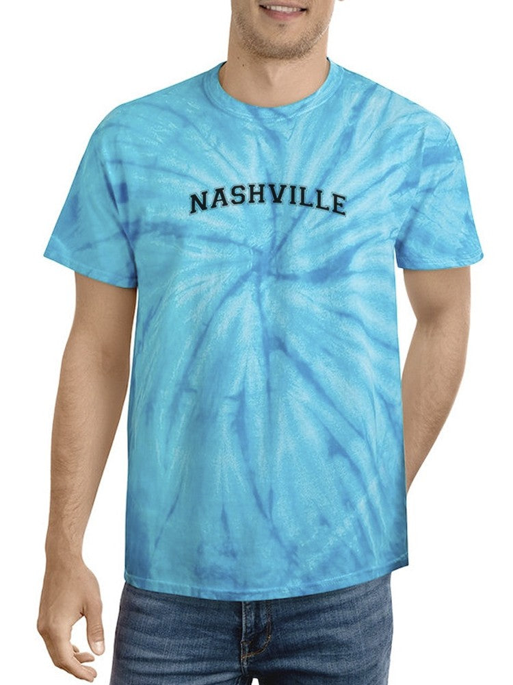a man wearing a tie dye shirt