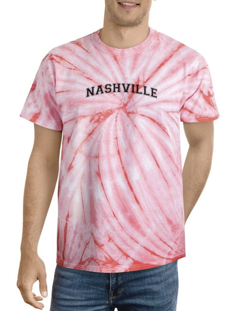 a man wearing a tie dye shirt