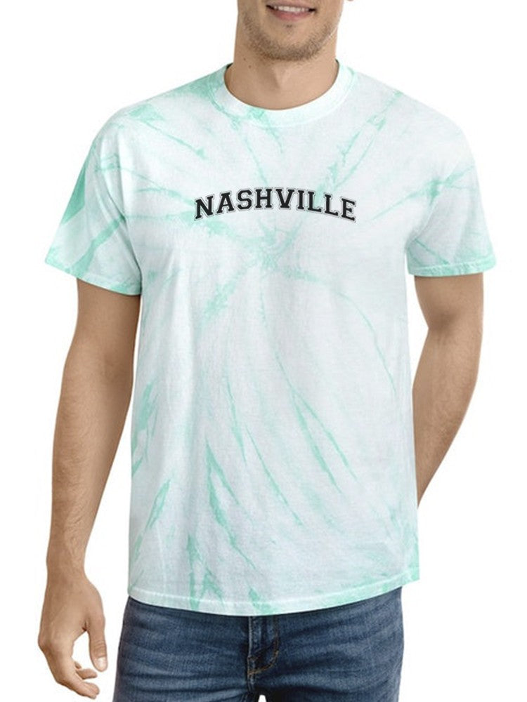 a man wearing a tie dye shirt