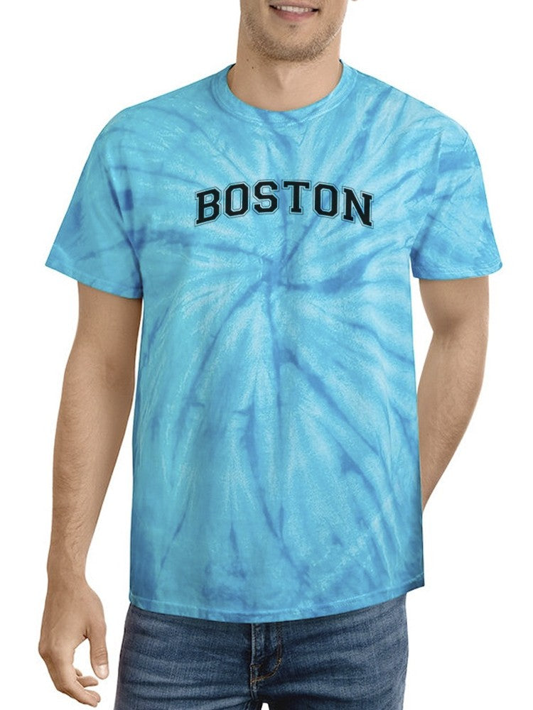 a man wearing a tie dye shirt
