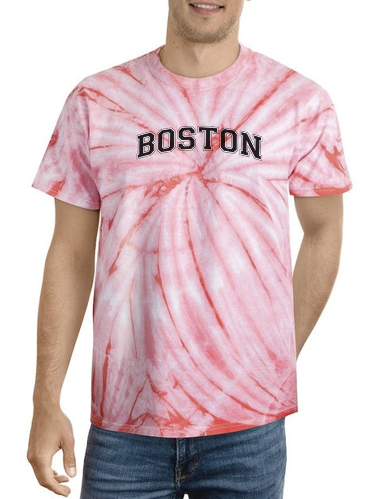 a man wearing a tie dye shirt