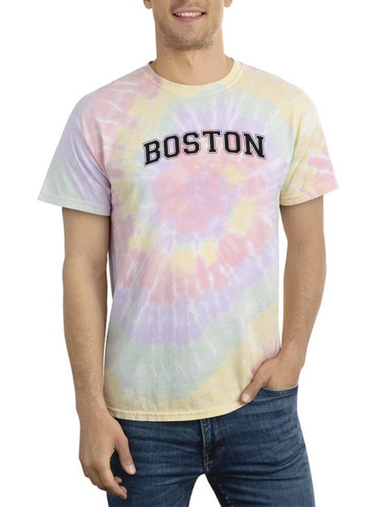 a man wearing a tie dye shirt