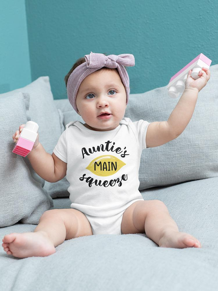 a baby holding a toy