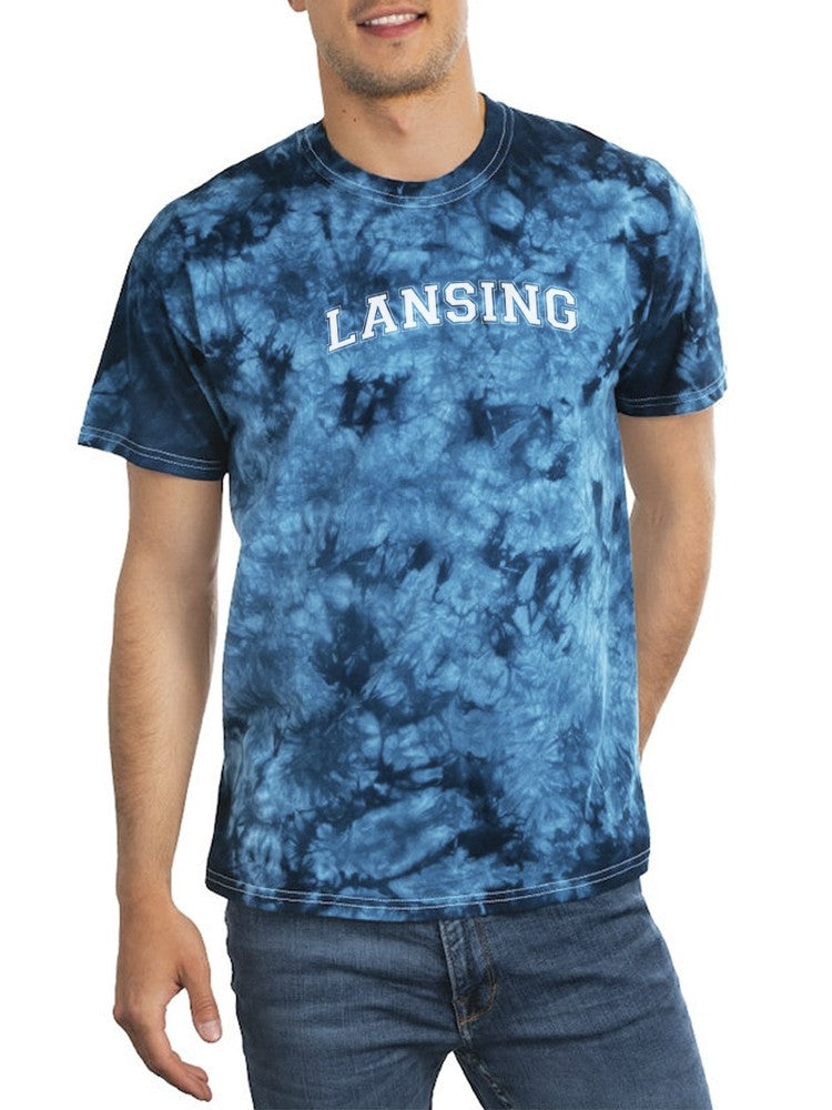 a man wearing a tie dye shirt