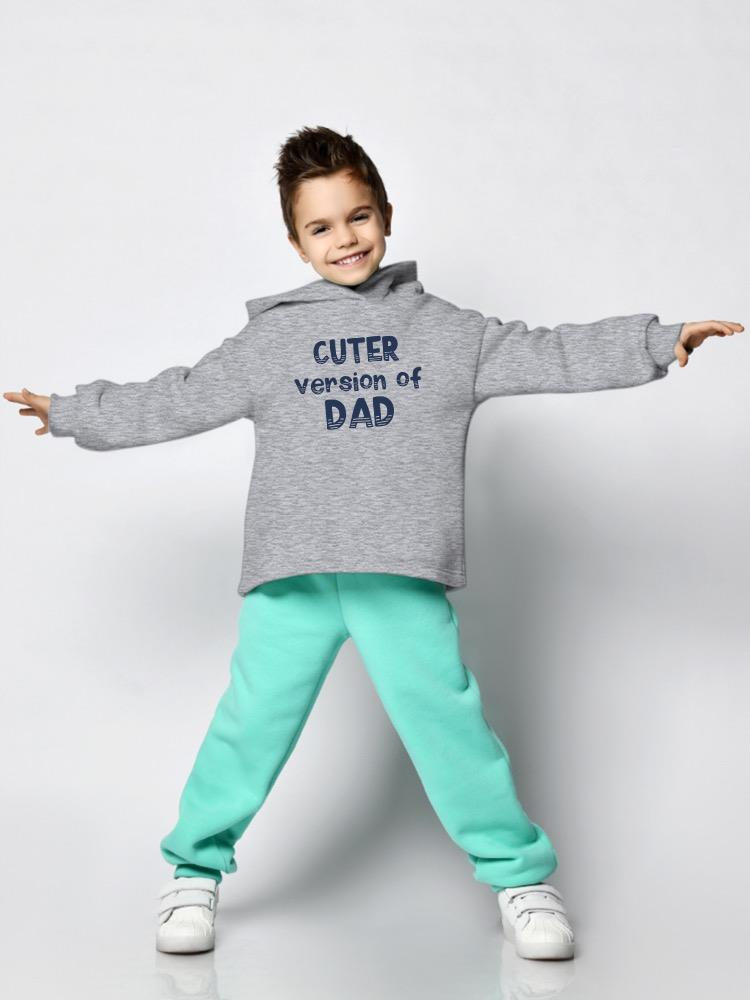 a boy wearing a grey sweatshirt and mint pants