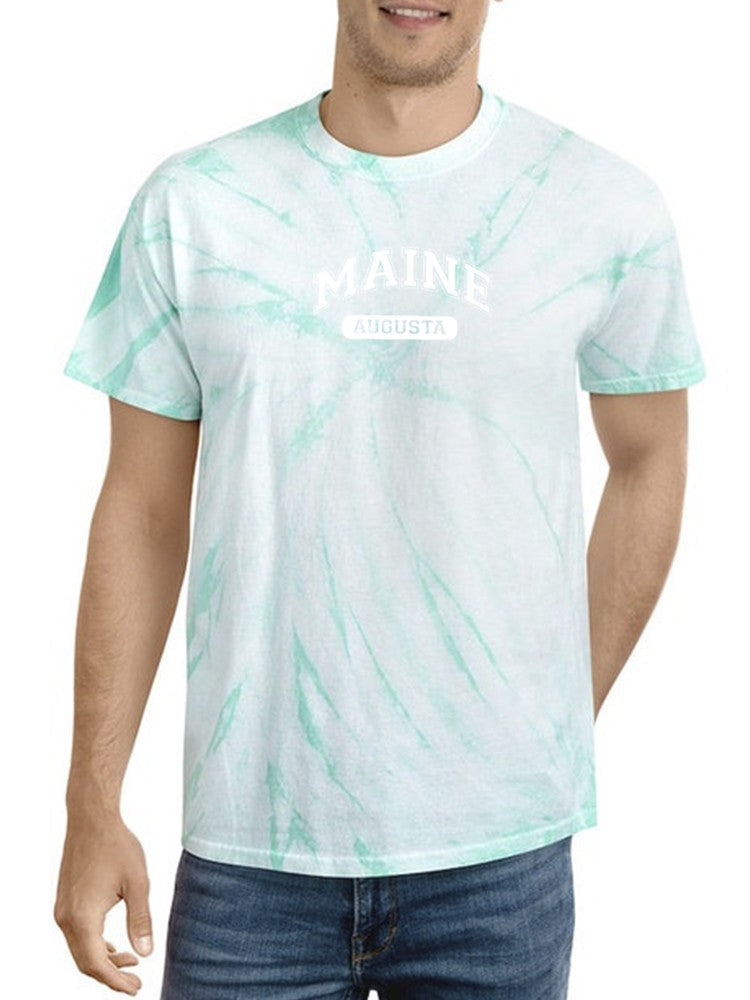 a man wearing a tie dye shirt